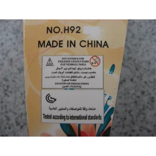 Păpușă din plastic cu păr roșu și verde, cu formă de sirenă.