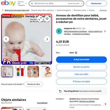 Teether în formă de cărămidă de construcție de jucărie cu un cablu și părți detașabile. Produs vândut online, în special prin intermediul eBay (identifer unic: 167636875338).