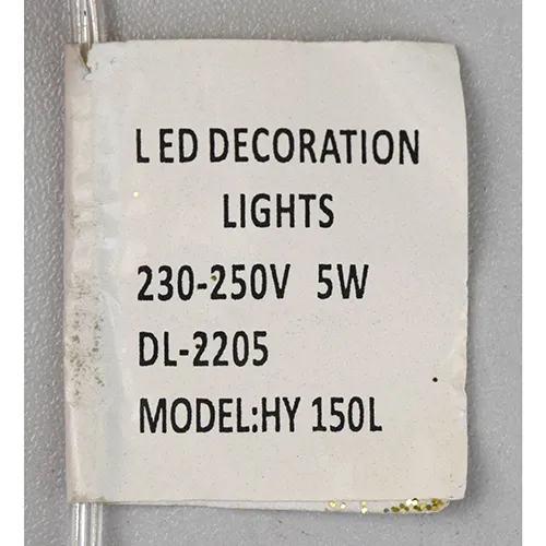 Corp de iluminat decorativ în formă de ren cu lumini LED galbene, corp cu sclipici auriu, fire transparente izolate și o cutie electronică albă de control marcată EK-04. Produsul este livrat cu un set de extensie a cablului.